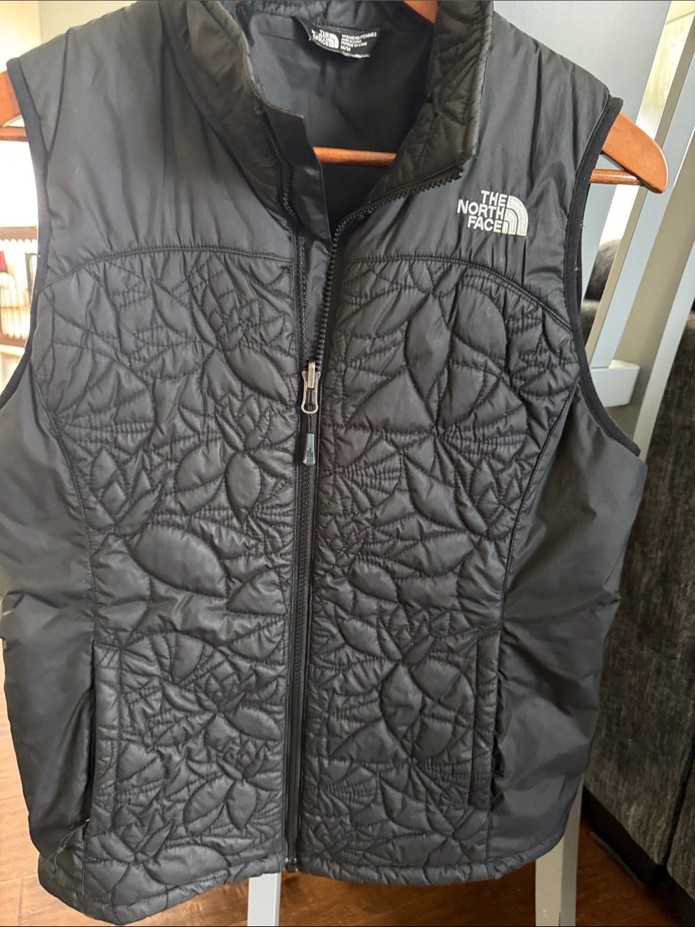 The North Face Black Quilted womens’s Vest with Floral Stitching good condition